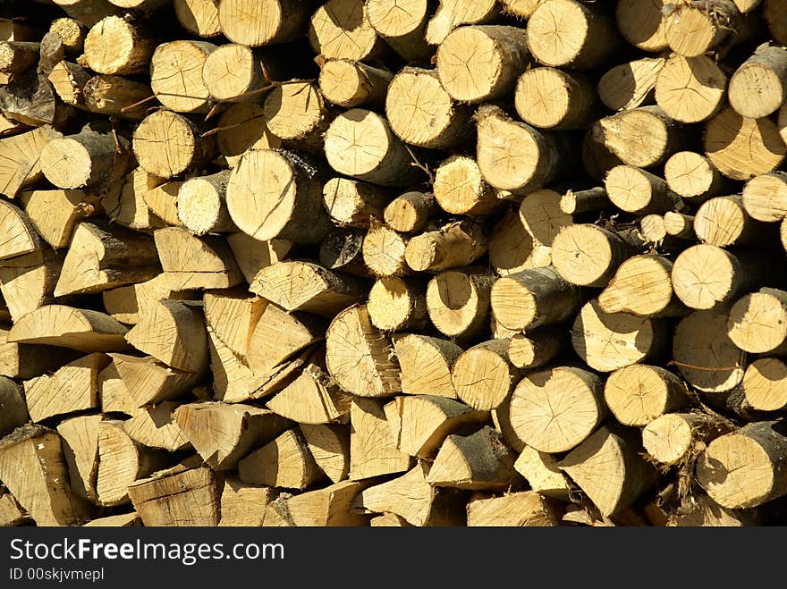 The cut and chopped fire wood are stacked in a heap