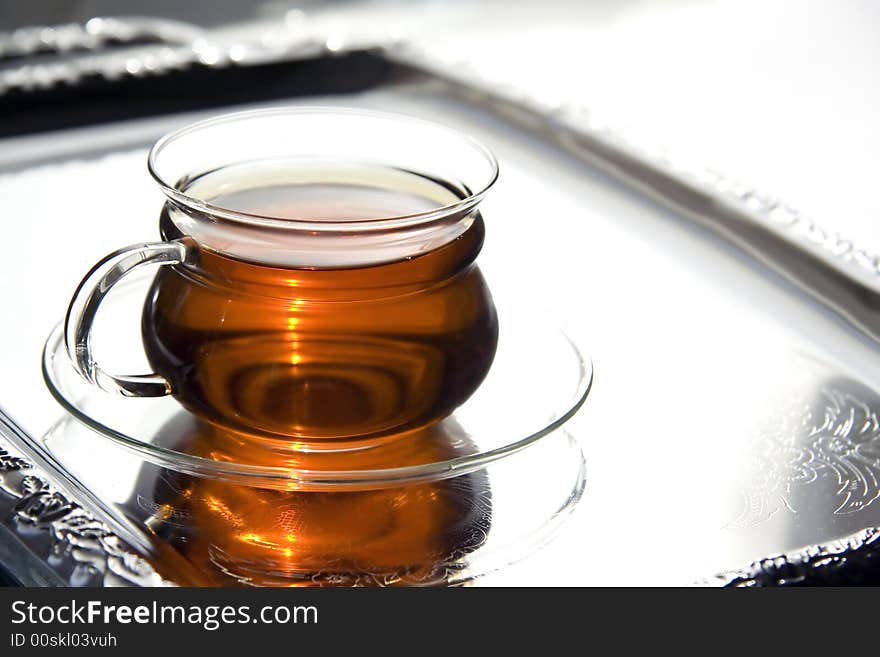 Transparent Cup Of Tea On The Salver