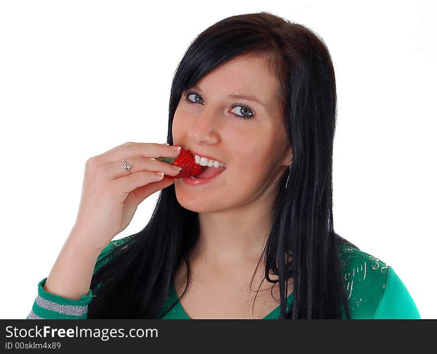 A girl eating a strawberry high resolution