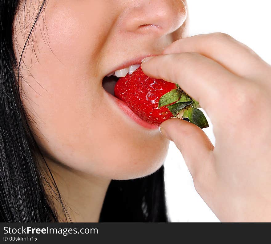 A Girl Eating A Strawberry