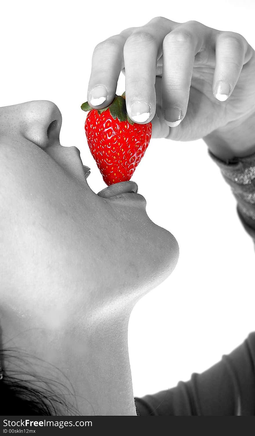 A girl eating a strawberry high resolution