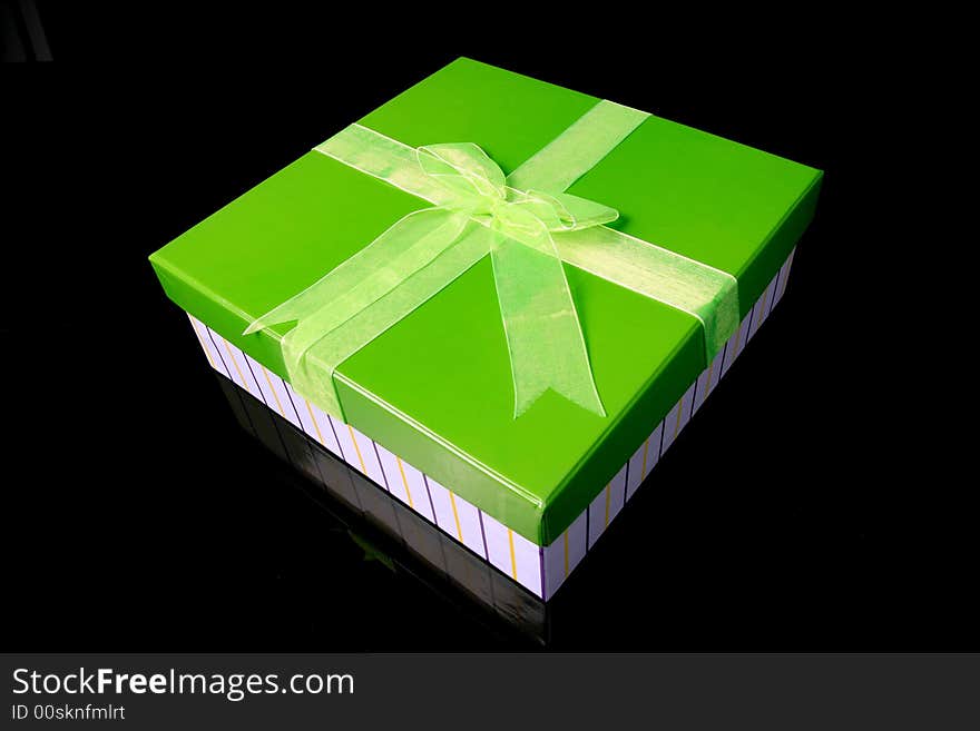 A green gift box with big tie. A green gift box with big tie