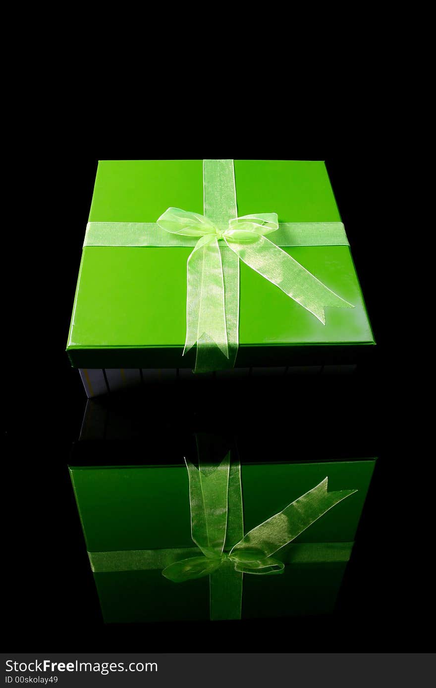 A green gift box with reflex