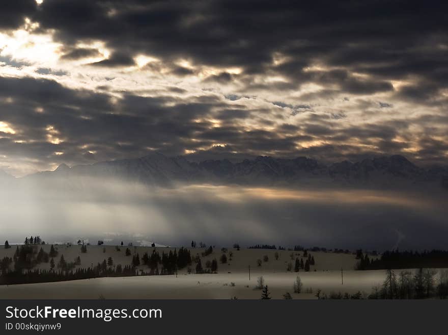 Sunbeams on cloudy day