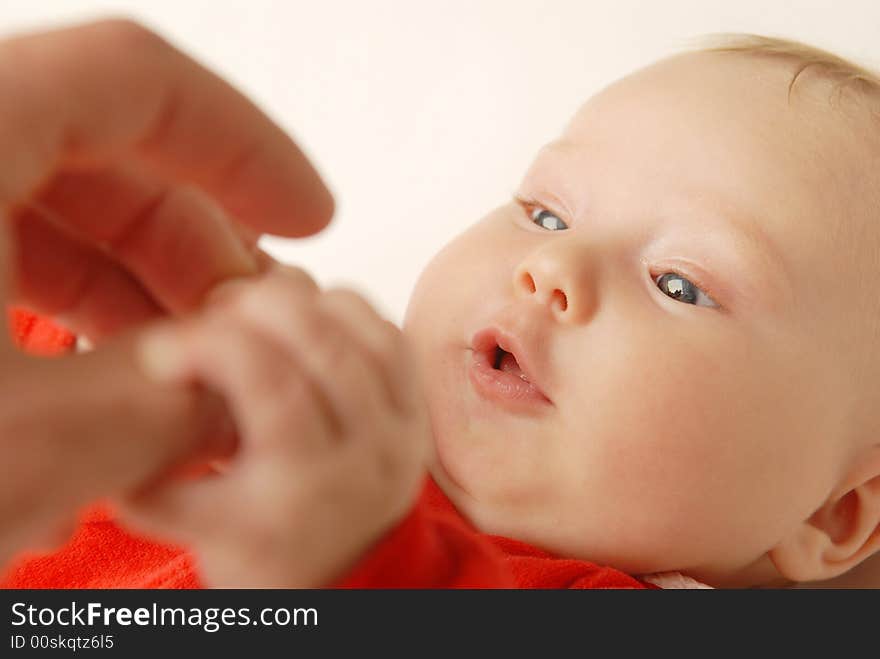 A baby and father's finger