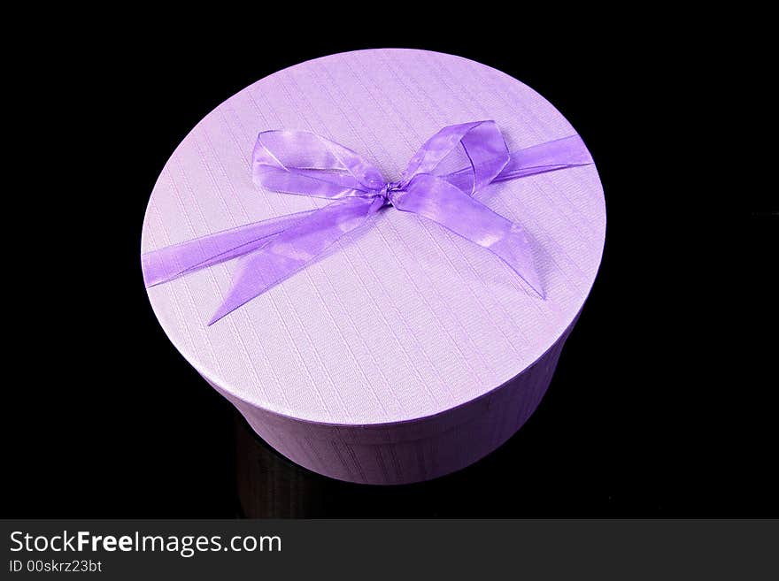 Purple present box with a purple ribbon