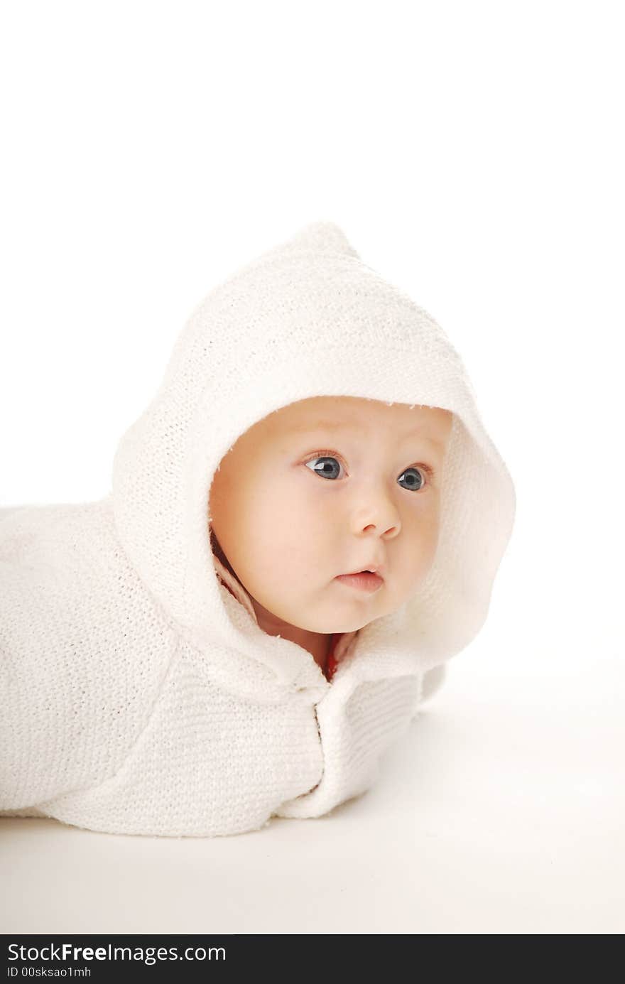 A baby in white hood