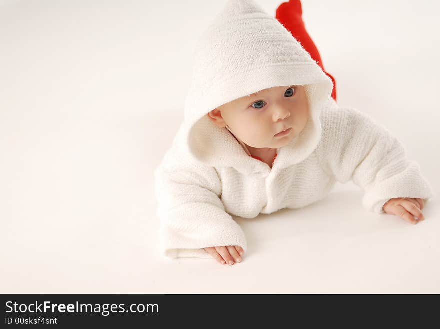 A baby in white hood