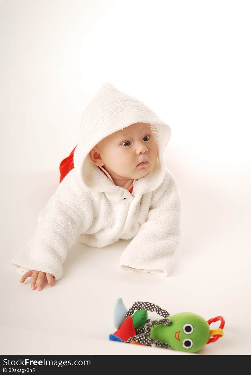 A baby in white hood