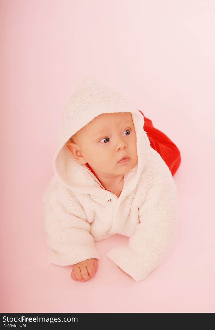 A baby in white hood