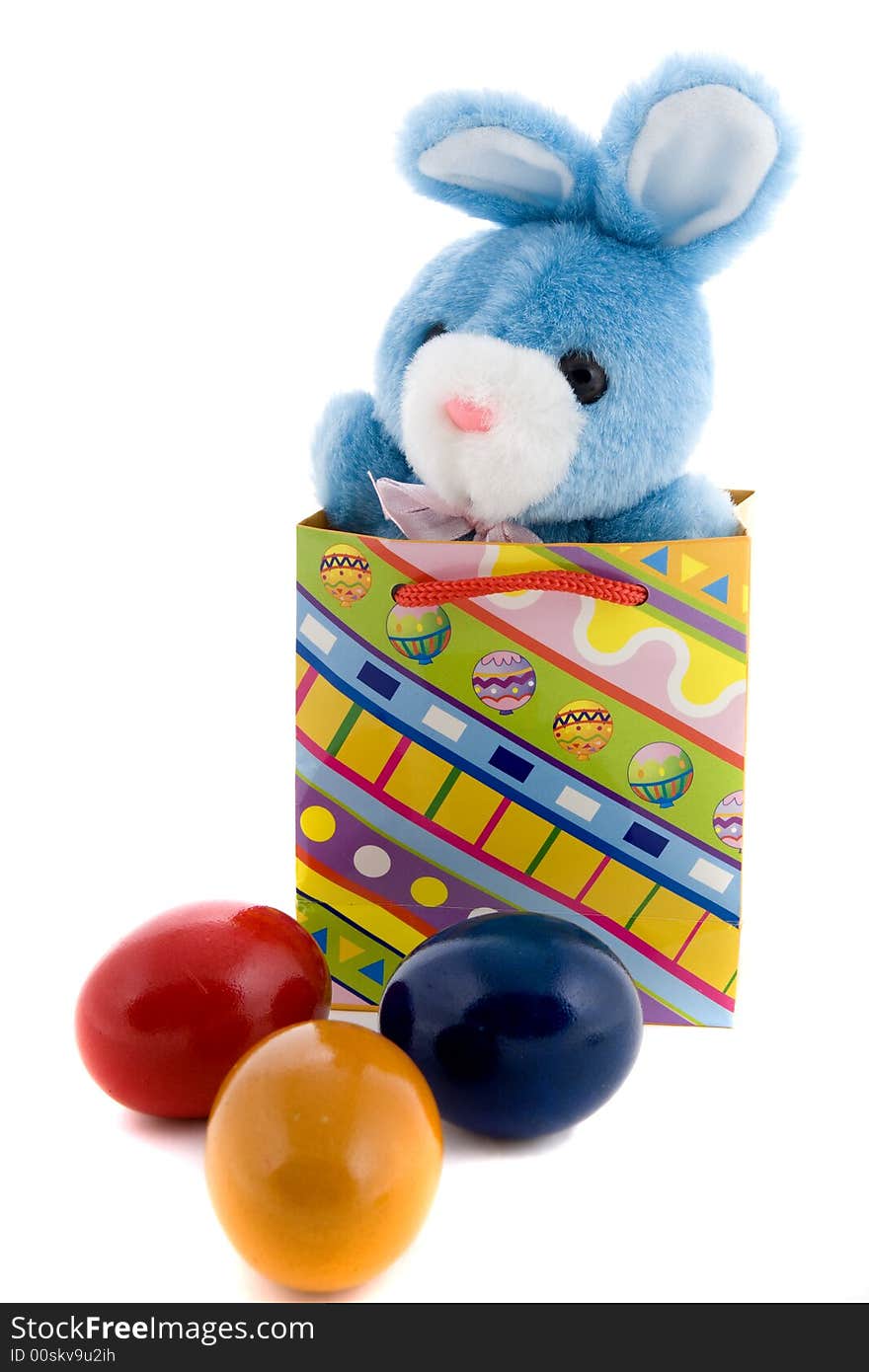 Blue plush bunny in an Easter decoration. Blue plush bunny in an Easter decoration