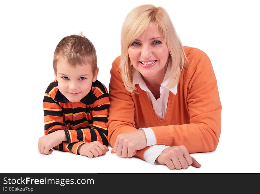 Middleaged woman with boy lying on white