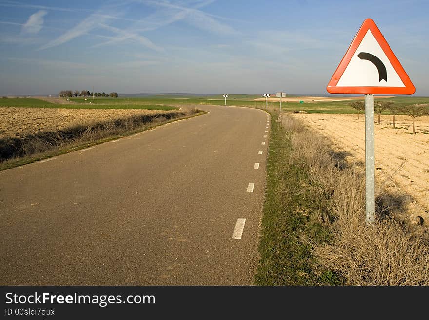 Signal of dangerous curve in a remote road