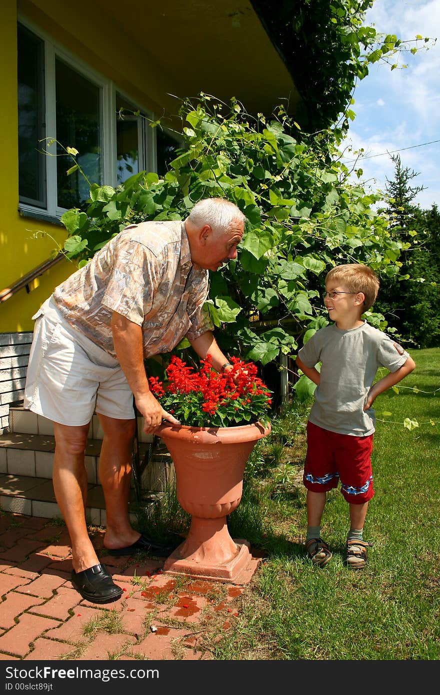 Grandfather and grandson in summer day