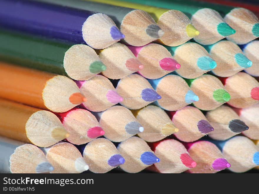 Crayon sharpened ends in stack viewed from angle. Crayon sharpened ends in stack viewed from angle