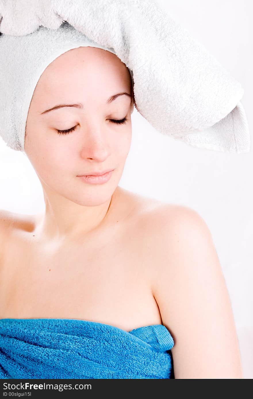 Young woman is dreaming with a towel on her head. Young woman is dreaming with a towel on her head