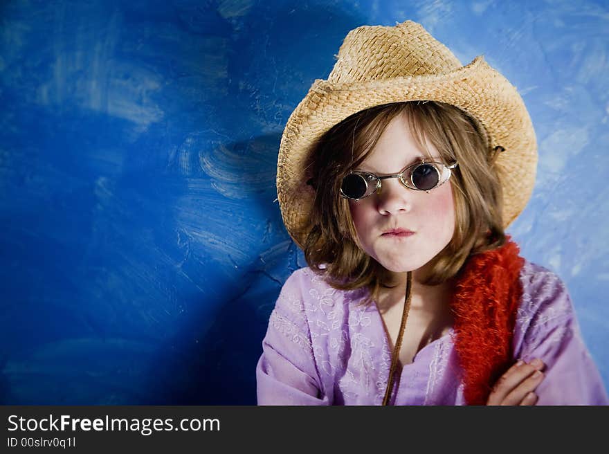 Mad Young Girl Wearing a Straw Cowboy Hat and Funny Sunglasses. Mad Young Girl Wearing a Straw Cowboy Hat and Funny Sunglasses