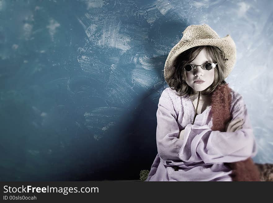 Mad Young Girl Wearing a Straw Cowboy Hat and Funny Sunglasses. Mad Young Girl Wearing a Straw Cowboy Hat and Funny Sunglasses