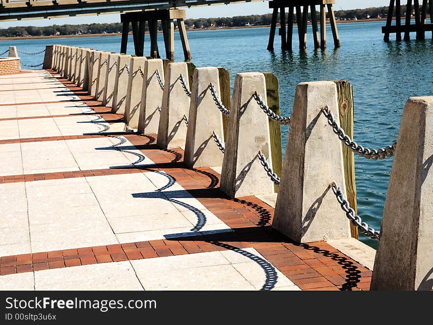 Chained fence on shore