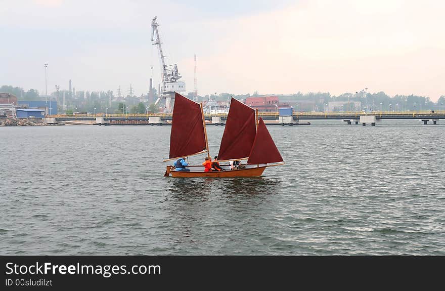 Sailing vessel floating in a bay of port.