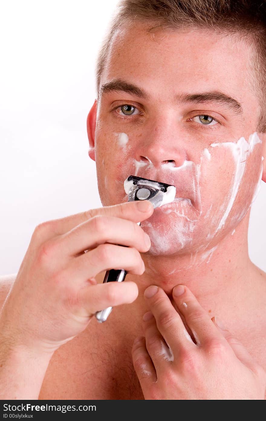 Shaving his face