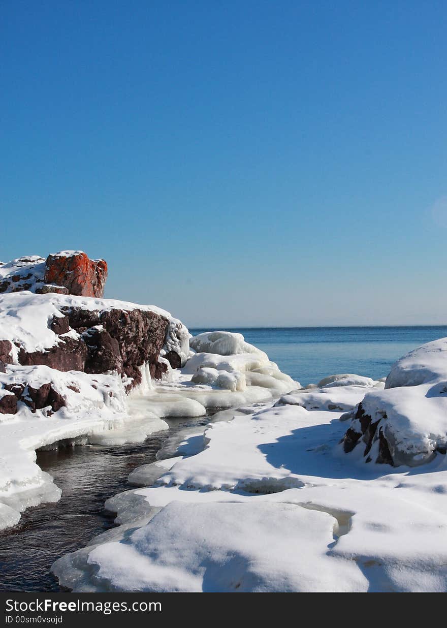 Frozen Mountain river running into Lake Superior. Frozen Mountain river running into Lake Superior