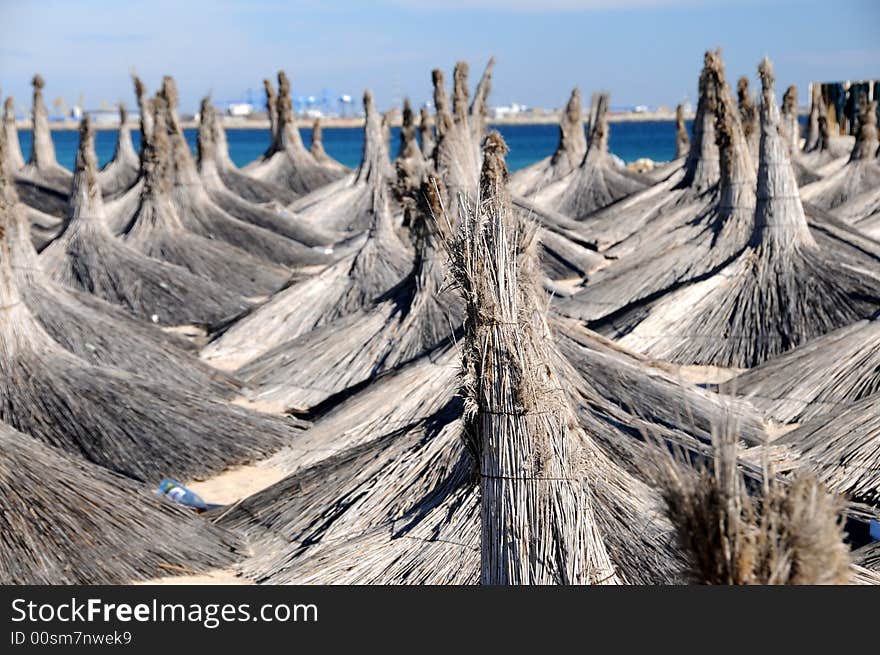 Blue sky with straw roofs