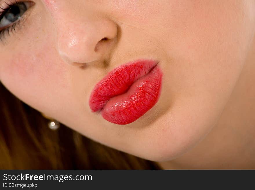 Smile of a beautiful young woman on white background