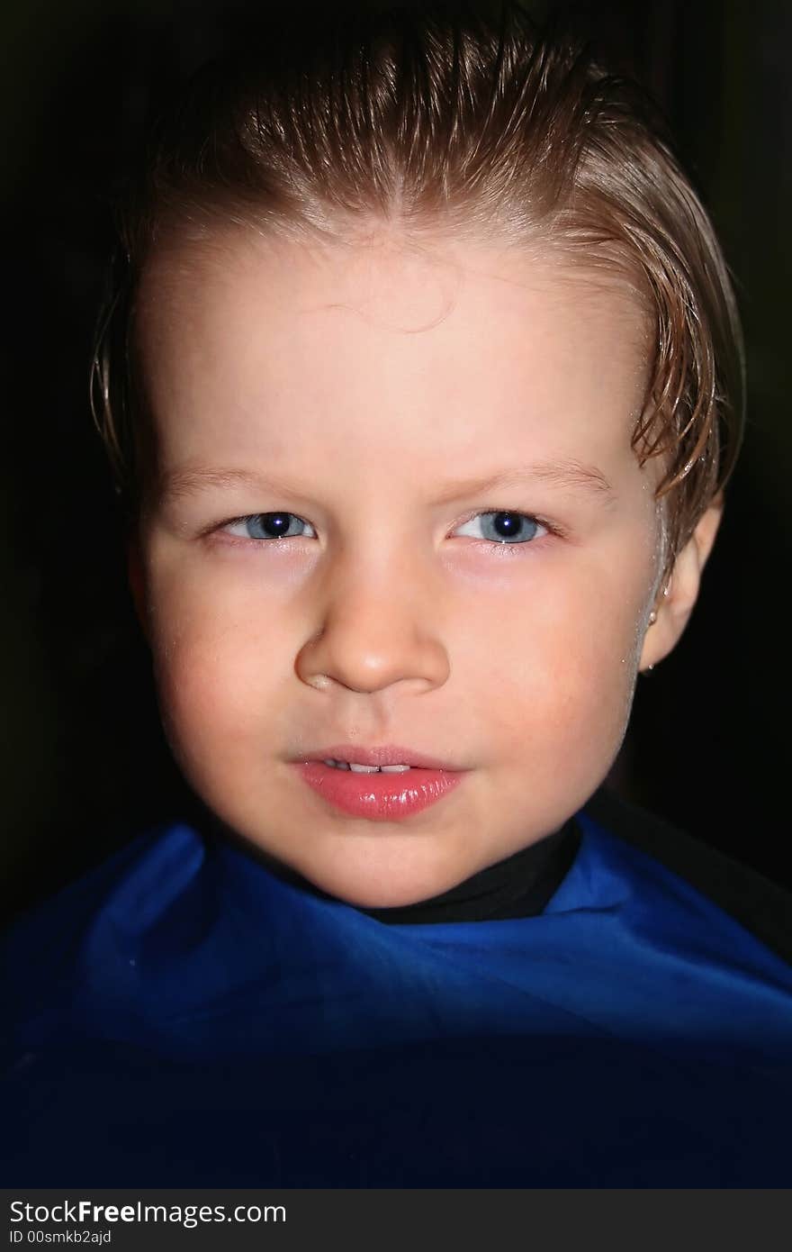 Portrait of a nice boy with wet hair on black background. Portrait of a nice boy with wet hair on black background