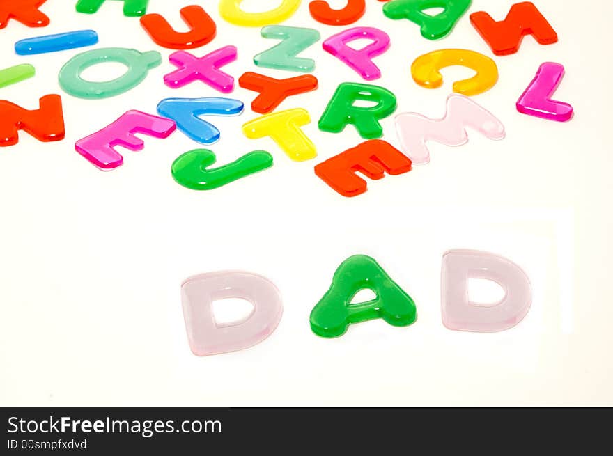 Color gel alphabet letters and word DAD. Isolated on white