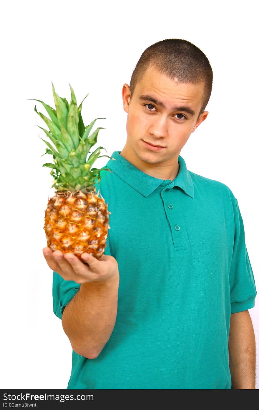 Boy with big orange-green pineapple. Boy with big orange-green pineapple