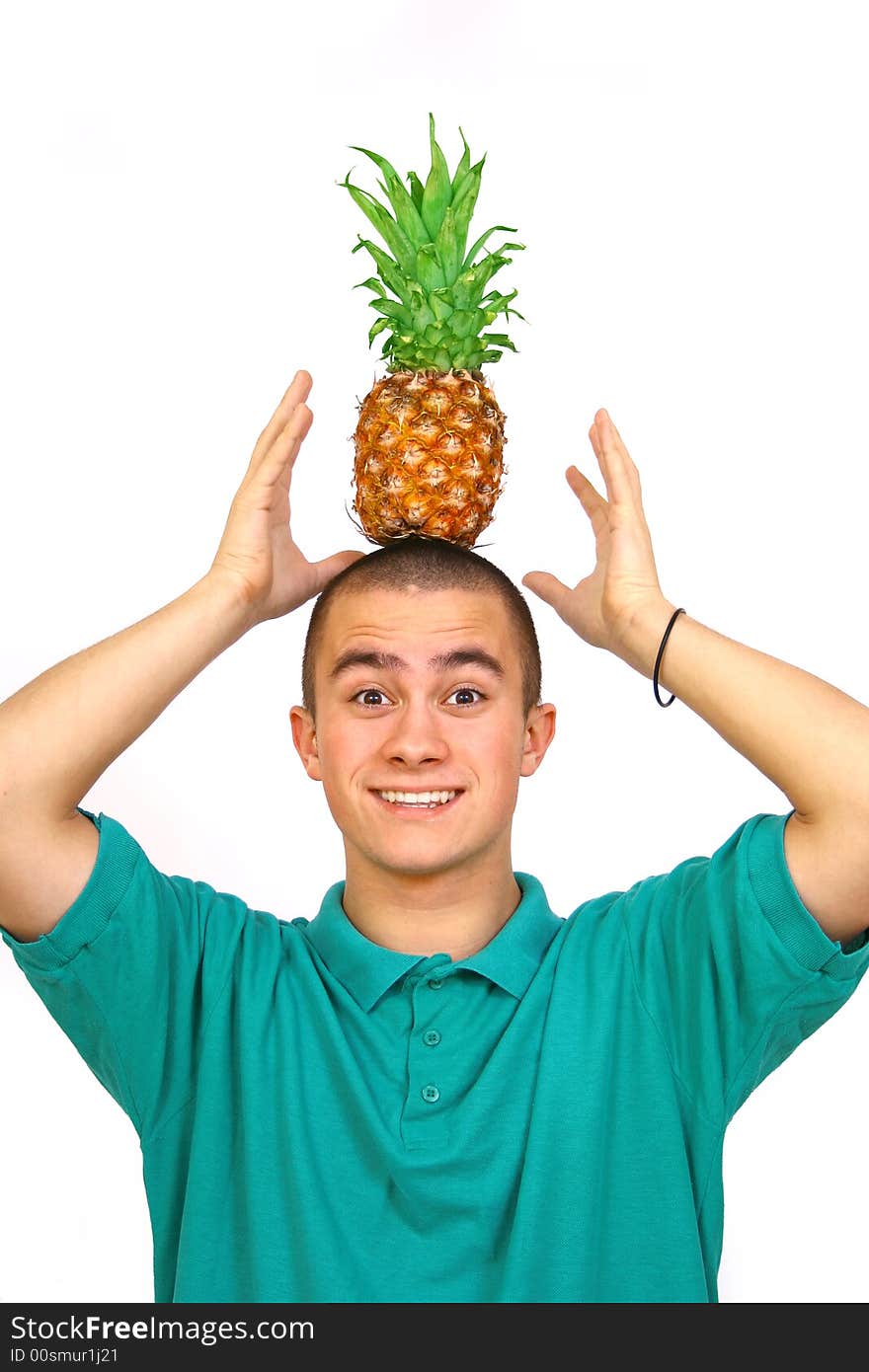 Boy with big orange-green pineapple. Boy with big orange-green pineapple