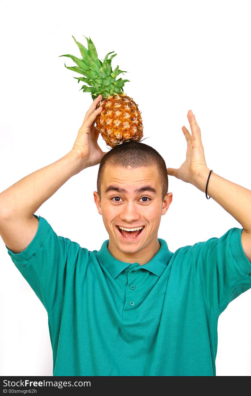 Boy with big orange-green pineapple. Boy with big orange-green pineapple