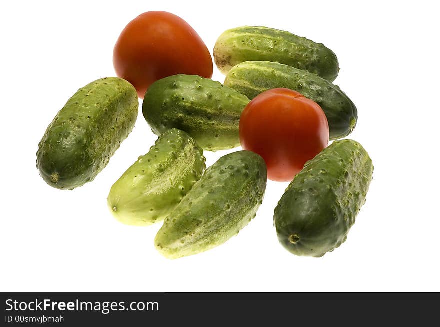 Tomato with cucumber isolated on the white background