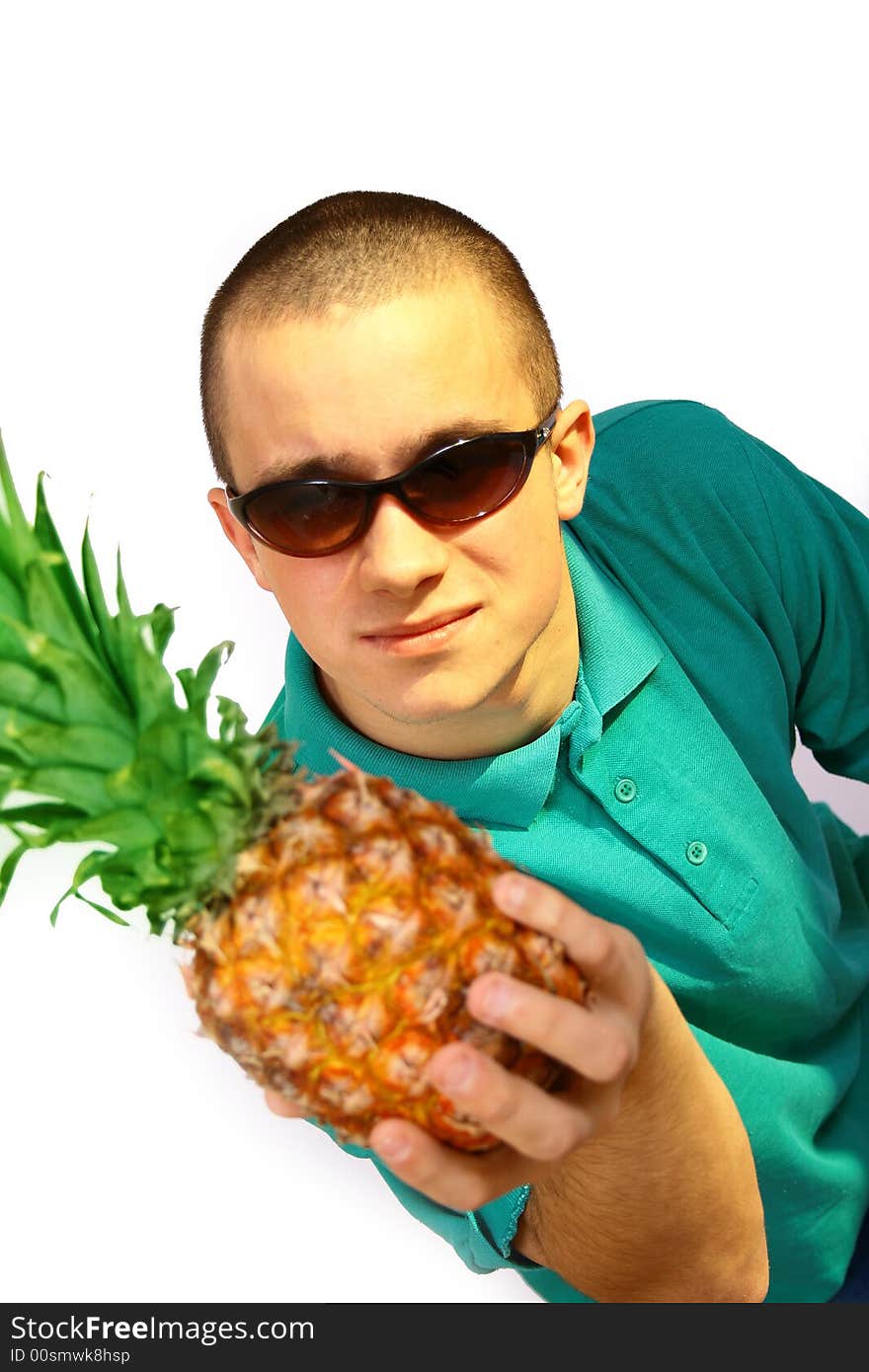 Boy with big orange-green pineapple. Boy with big orange-green pineapple