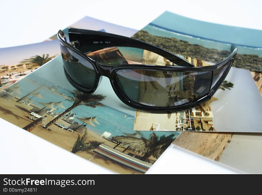 Black sun glasses on the photo from holiday