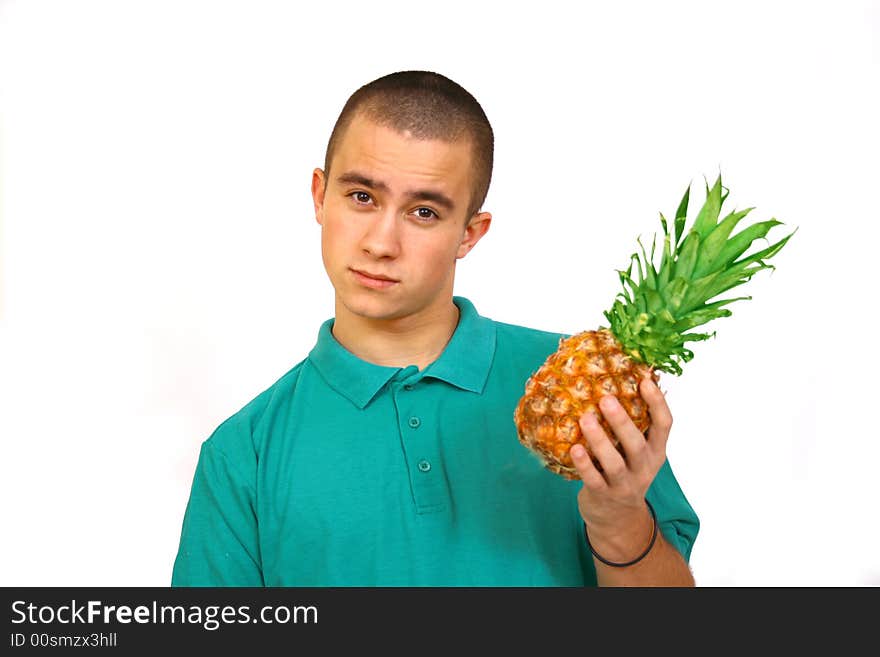 Boy with big orange-green pineapple. Boy with big orange-green pineapple