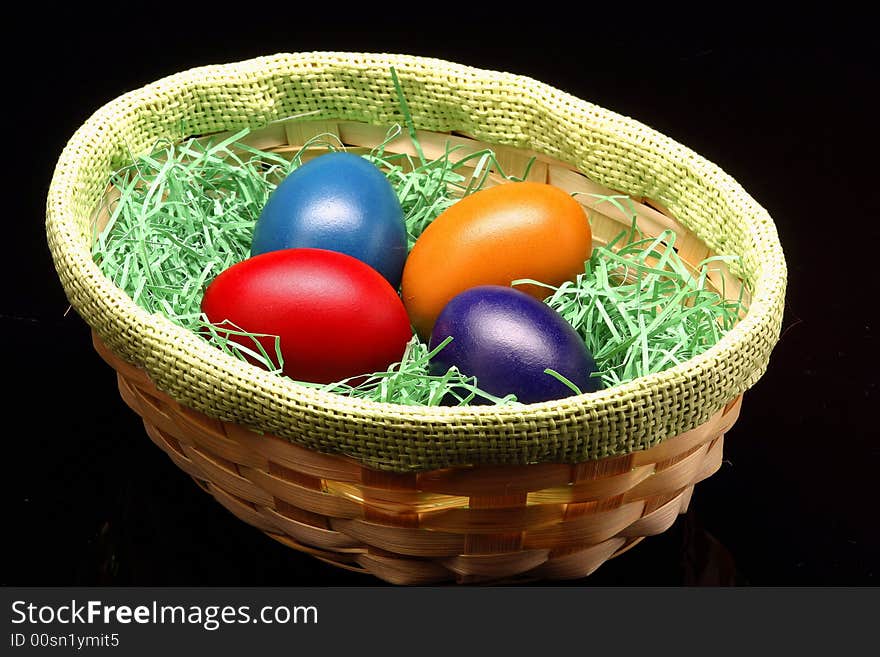 The Easter eggs are standing in basket. The Easter eggs are standing in basket