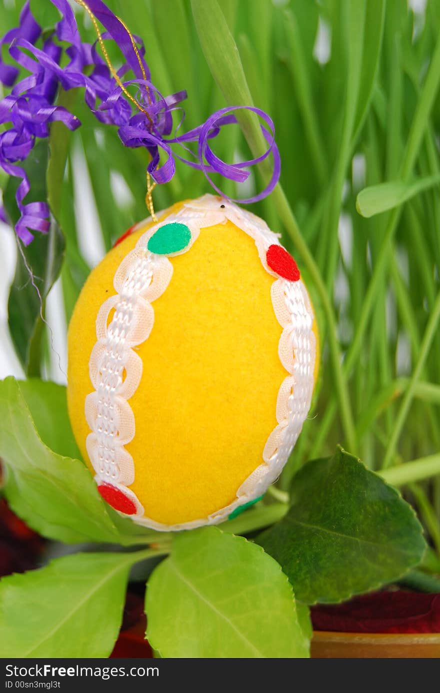 Easter egg with green grain and foliage