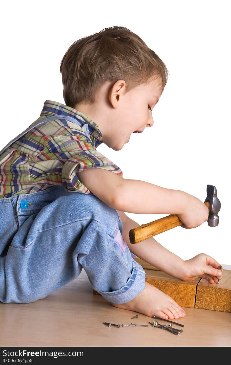 Kid Hammers A Hammer In Nails