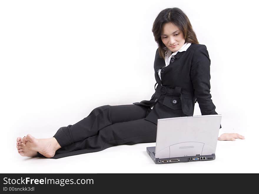 An Asian beautiful girl with confident with laptop and agenda book - isolated on white. An Asian beautiful girl with confident with laptop and agenda book - isolated on white