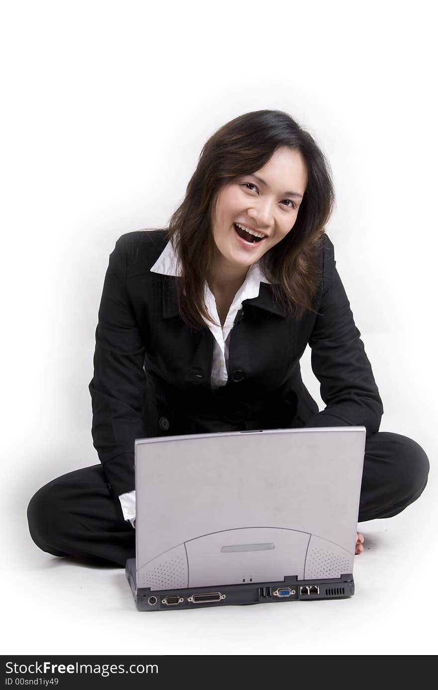 An Asian beautiful girl with confident with laptop and agenda book - isolated on white. An Asian beautiful girl with confident with laptop and agenda book - isolated on white