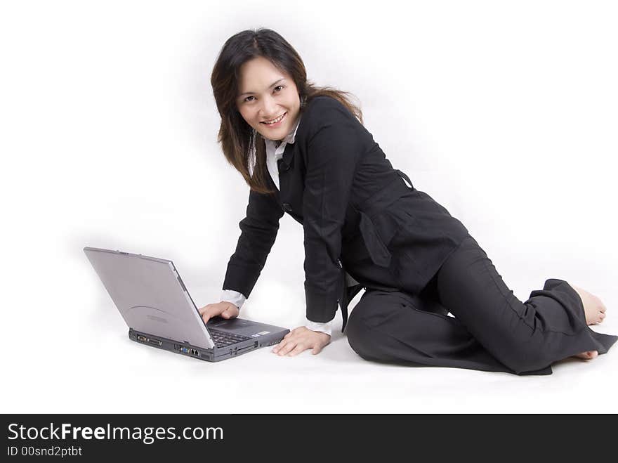 An Asian beautiful girl with confident with laptop and agenda book - isolated on white. An Asian beautiful girl with confident with laptop and agenda book - isolated on white