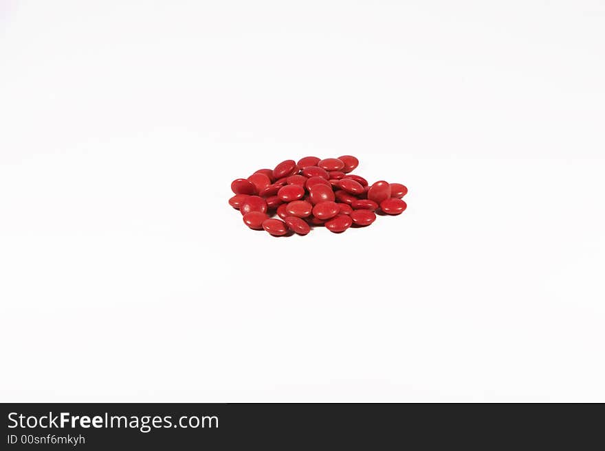 Red pills isolated on white background