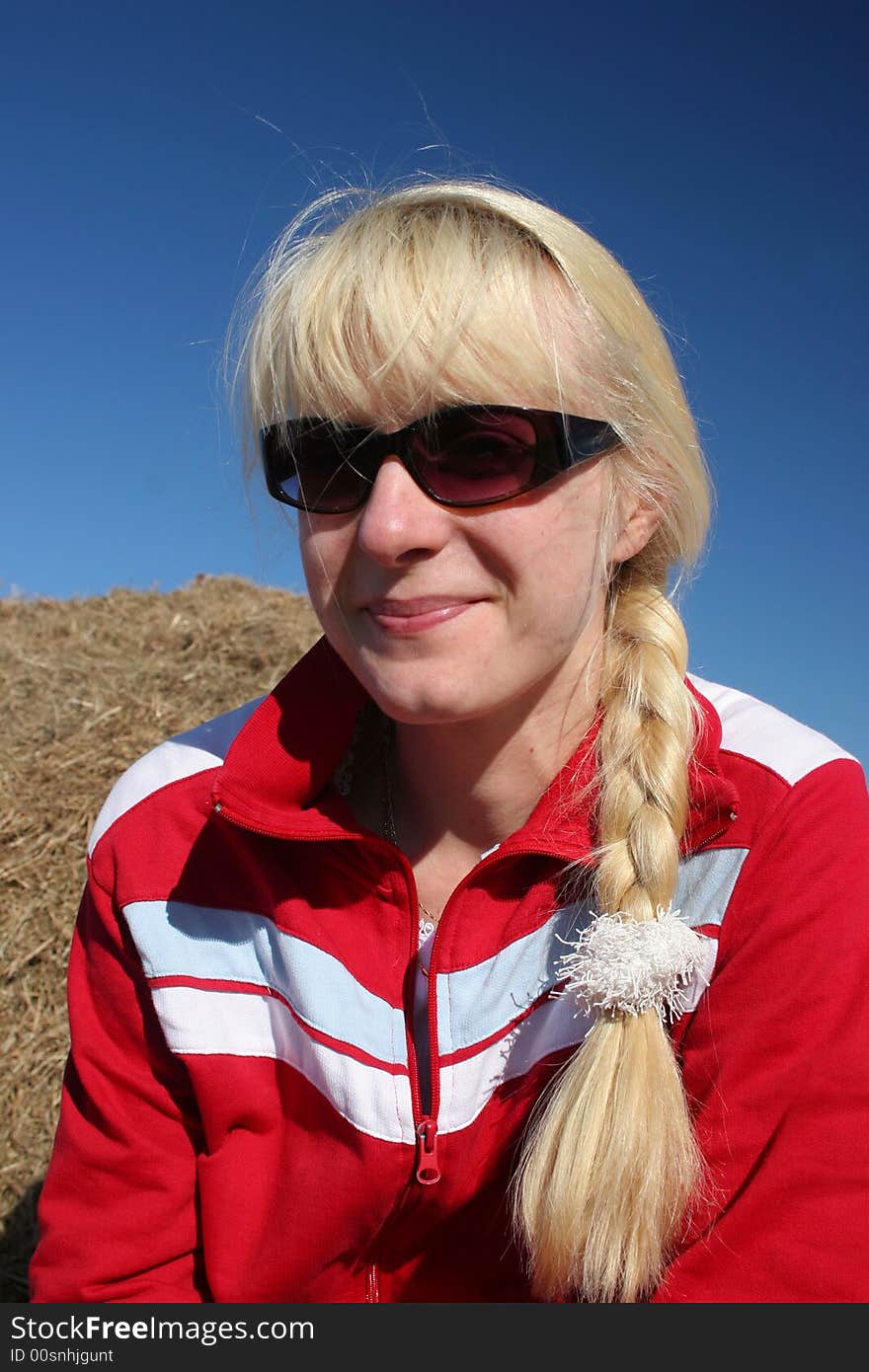 Portrait of a blond girl in the hay. Portrait of a blond girl in the hay