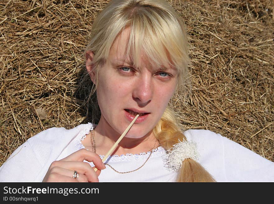 Blond  girl in hay