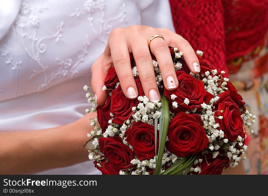 Bride, showing her hand with wedding ring. Bride, showing her hand with wedding ring.