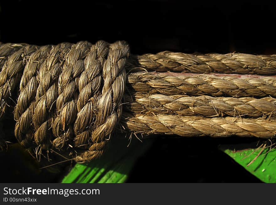 Old rope on black background