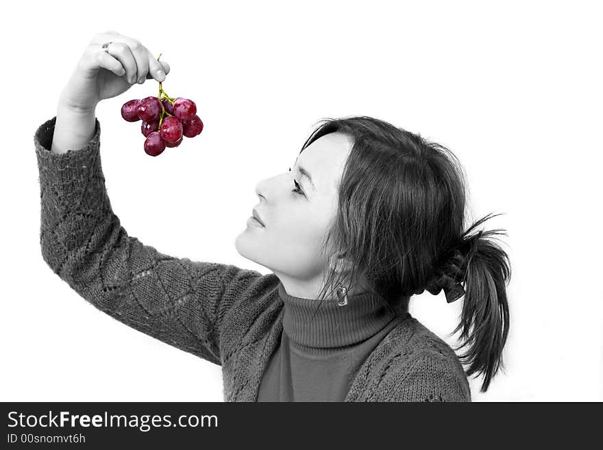 Young girl is holding grapes in the palm