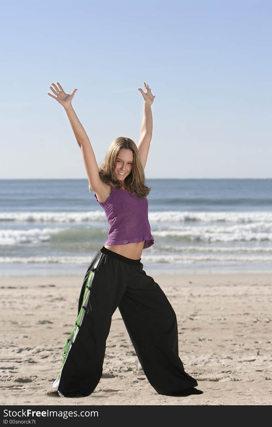 Woman stretching at the beach